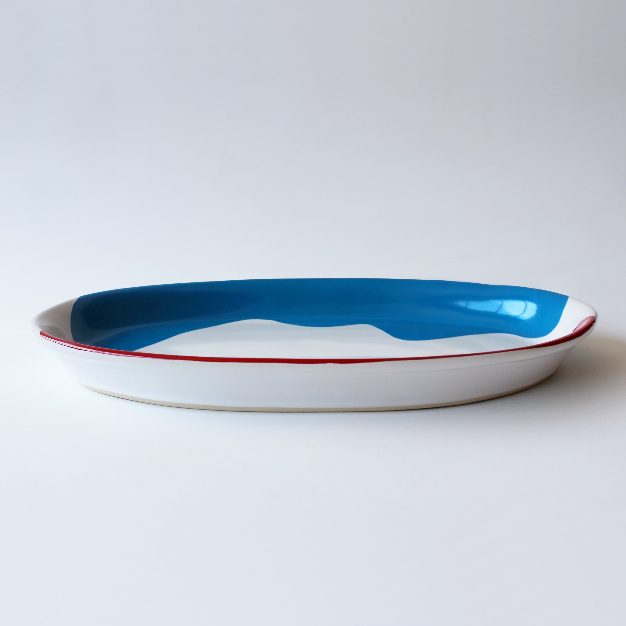 Gloss White Trout Platter accented with hand-applied sweeps of colour