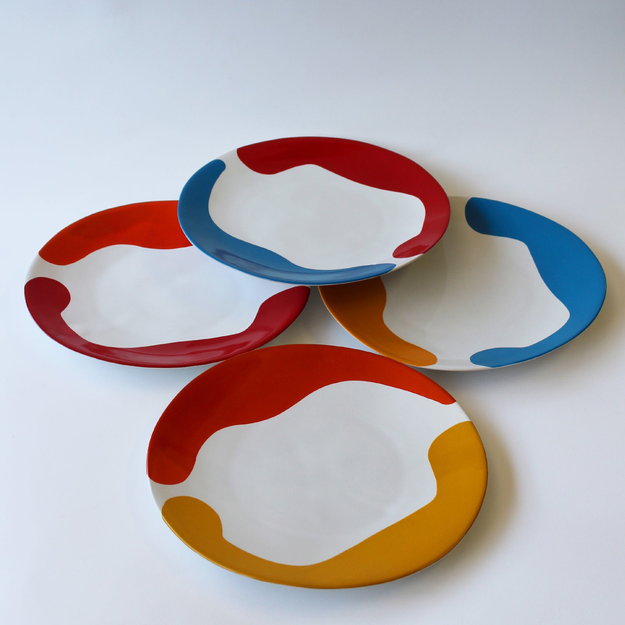 Gloss White Dinner Plates accented with hand-applied sweeps of colour, set of 4